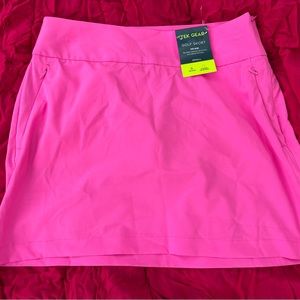 Hot pink golf skort(w shorts). New with tags. Polyester/spandex.